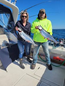 Two anglers enjoying a fishing trip in MI