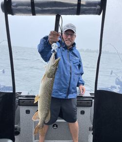 Angler with a northern pike in Cape Vincent