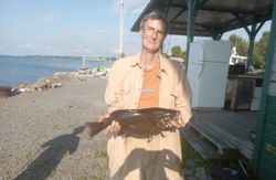 Angler with one 18-inch fish caught at Cape Vincent