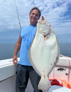 Angler holding a 36-inch fish in MA