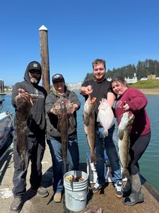 Anglers fishing in OR with 4 large fish
