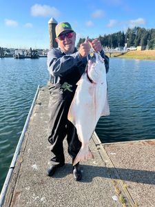 A person fishing in Oregon with the best, great catch