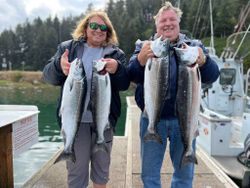 Four Coho and Chinook Salmon caught during a fishing tour in Roseburg