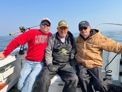 Three people enjoying a fishing tour in OR.
