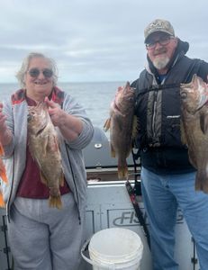 Two anglers fishing in Oregon with 3 fish