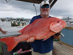 Angler with a big fish at Fort Morgan