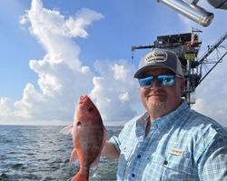 A lone angler fishing at Fort Morgan