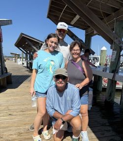 Four people fishing at Fort Morgan