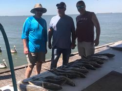 Three anglers enjoying a fishing trip in TX
