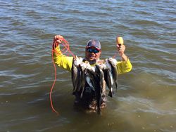 Two people enjoying a fishing trip in Galveston