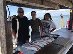 Three people posing for a photo in Galveston