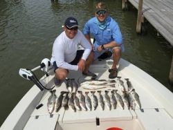 Two people fishing in TX