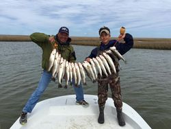 Three people fishing in TX