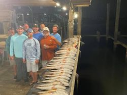 A group of 8 people enjoying a fishing trip in LA