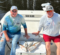 Two anglers with fishing rods enjoying the day in Florida