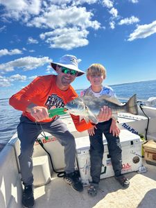A angler with a large black drum fish caught in Old Town