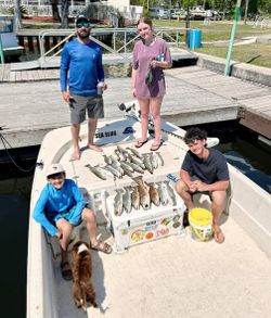 Fishing charter displaying catch of multiple fish on boat deck at Old Town FL marina