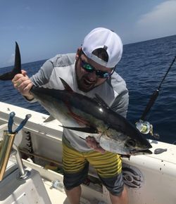 A person fishing in the waters of Panama City