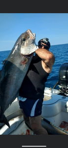 A fisherman with a fishing pole in Panama City