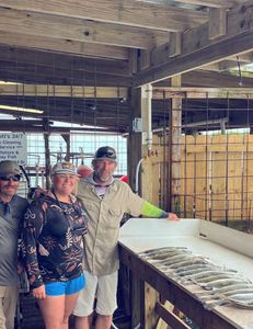 Three people enjoying a fishing trip in Port O'Connor