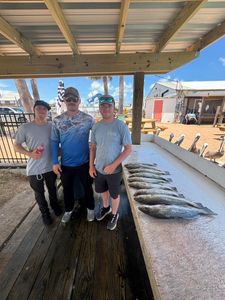 Three people enjoying fishing trip in Port O'Connor