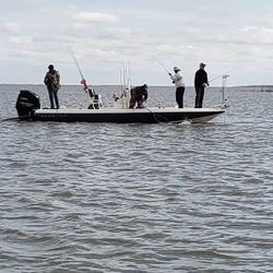 A lone fisherman casting his line in the waters of Buras