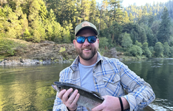 Angler with fishing rod in Grants Pass
