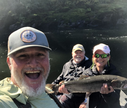 A group of 3 people fishing on the river in Grants Pass, Oregon