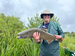 Fisherman with a 30-inch catch in Elk Rapids