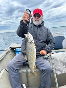 A lone angler fishing in Elk Rapids