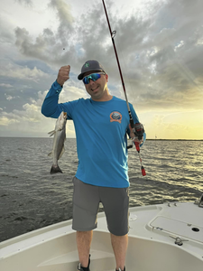 Photograph of a spotted weakfish, a single angler fishing in St Bernard
