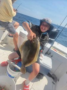 Summer flounder caught fishing in Norfolk VA displayed on boat deck
