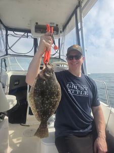 Summer flounder caught fishing in Norfolk VA waters displayed on boat