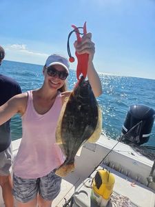 Summer flounder caught fishing in Norfolk VA displayed on boat deck