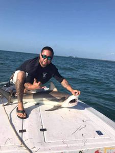 A person fishing in FL