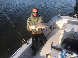Angler with a single 19-inch fish in Seminole