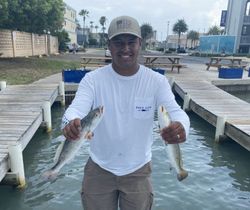 A person fishing at the scenic South Padre Island