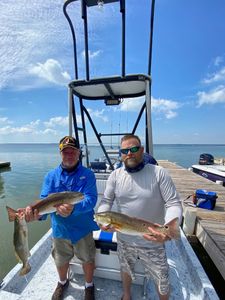 Two redfish, 22 inches long, caught while fishing at South Padre Island