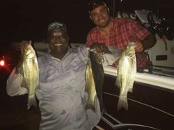 Three fishing enthusiasts in Leesburg with a great catch
