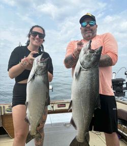 Two anglers fishing for lake trout and chinook salmon in St. Catharines
