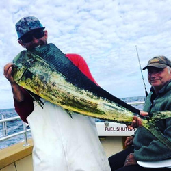 A lone fisherman in Wanchese, reeling in a 31-inch catch