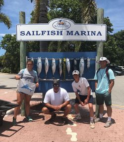 A group of 4 people fishing in FL