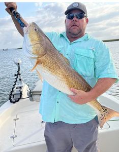 Solo angler with a catch on Bolivar Peninsula