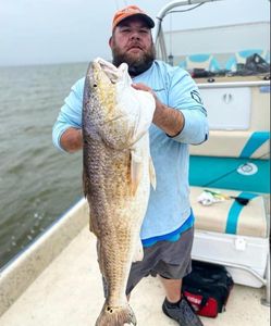 A person fishing in TX