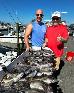 Two anglers enjoying a great fishing trip in NJ