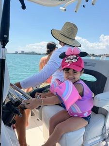 Boat cruise on turquoise waters in North Miami FL with clear blue skies