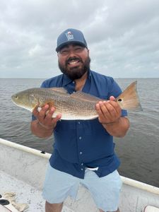 Happy angler with a big redfish.