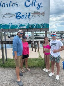 Family with fresh fish catch.