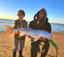 Two people fishing at Gilchrist location