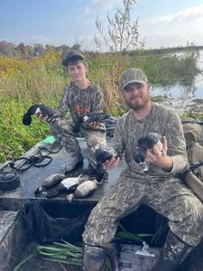 Two people enjoying fishing and hunting activities in Crystal River